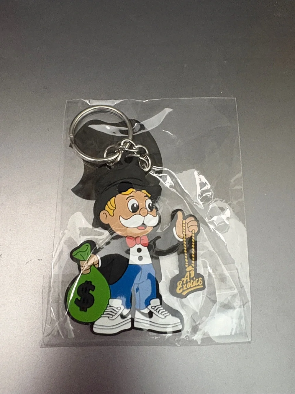A Exotics Black & Multicolor Cartoon Money Bag Keychain